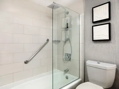 a bathroom with a shower and a toilet at The Westin San Diego Bayview in San Diego