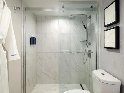 a bathroom with a glass shower with a toilet at The Westin San Diego Bayview in San Diego