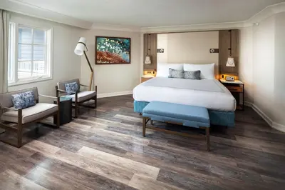 a hotel room with a bed and a desk and a chair at Laguna Cliffs Marriott Resort & Spa in Dana Point