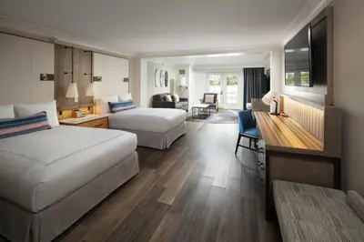a hotel room with two beds and a living room at Laguna Cliffs Marriott Resort & Spa in Dana Point