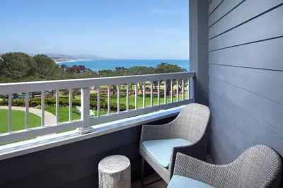 two chairs on a balcony with a view of the ocean at Laguna Cliffs Marriott Resort & Spa in Dana Point