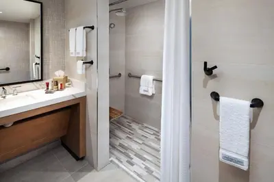 a bathroom with a shower and a sink at Laguna Cliffs Marriott Resort & Spa in Dana Point