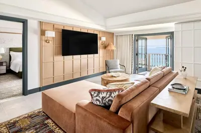 a living room with a couch and a flat screen tv at The Ritz-Carlton, Laguna Niguel in Dana Point