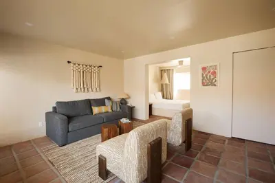 a living room with a couch and a table at Los Bungalows in Imperial Beach