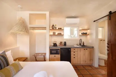 a small kitchen with a sink and a counter at Los Bungalows in Imperial Beach