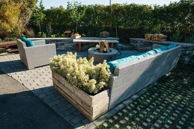 a patio with two chairs and a table and a bench at Inn at Moonlight Beach in Encinitas