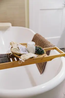 a wooden tray sitting on top of a bath tub at Inn at Moonlight Beach in Encinitas
