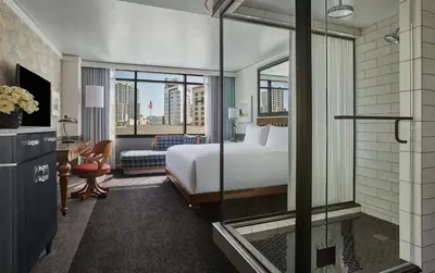 a hotel room with a bed and a window at Pendry San Diego in San Diego