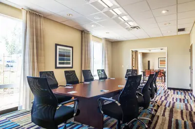 a conference room with a table and chairs at Fairfield Inn & Suites by Marriott San Diego North/San Marcos in San Marcos