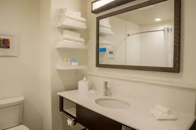 a bathroom with a sink and a mirror at Hampton Inn & Suites Murrieta Temecula in Murrieta