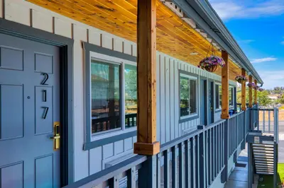 a front porch of a house with a blue door at Ramona Valley Inn - Ramona in Ramona