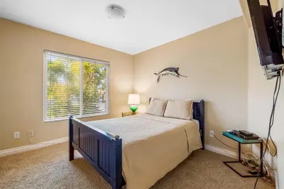 a bedroom with a bed and a window at The Shangri-La of La Jolla in San Diego