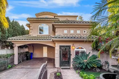 a large house with a driveway in front of it at The Shangri-La of La Jolla in San Diego