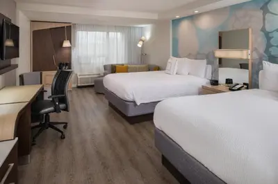 a hotel room with two beds and a desk at Courtyard by Marriott Temecula Murrieta in Murrieta