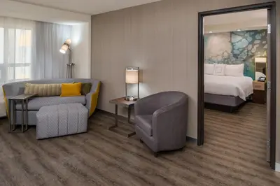 a hotel room with a bed and a chair at Courtyard by Marriott Temecula Murrieta in Murrieta