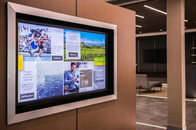 a flat screen tv on a wall in a building at Courtyard by Marriott Temecula Murrieta in Murrieta
