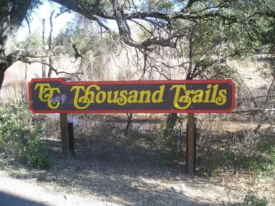 a sign for the town of flosslandisksemetery at Oakzanita Springs Camping Resort Cabin 1 in Descanso