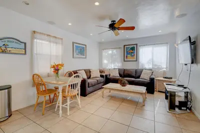 a living room with a couch and a table at Mike's Place at the Beach in San Diego