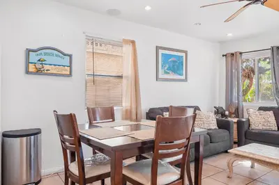 a living room with a table and a couch at Mike's Place at the Beach in San Diego