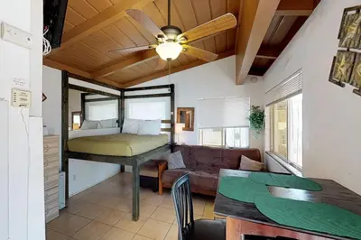 a living room with a bed and a couch at Sweet Sunset Studio in San Diego