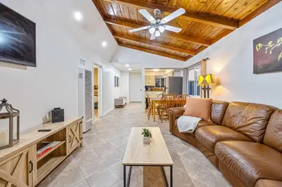 a living room with a couch and a table at Mimi's & Nana's Beach House in San Diego