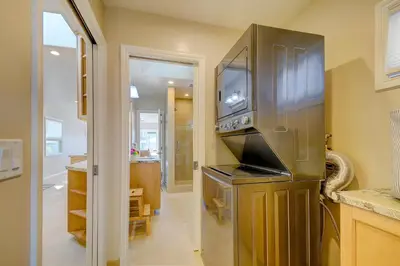 a kitchen with a large stainless steel refrigerator at Beach Park Getaway in San Diego