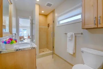 a bathroom with a toilet and a sink and a shower at Beach Park Getaway in San Diego