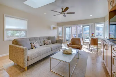 a living room with a couch and a table at Beach Park Getaway in San Diego