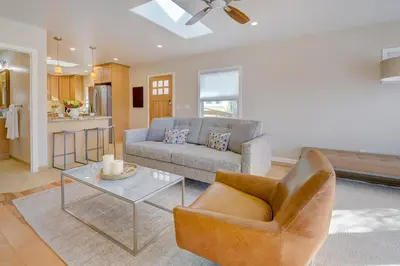 a living room with a couch and a table at Beach Park Getaway in San Diego