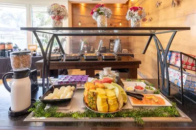 a buffet with a tray of food on a table at The Dana on Mission Bay in San Diego
