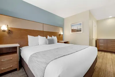 a large white bed in a hotel room at Best Western Carlsbad by the Sea in Carlsbad