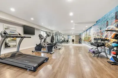 a gym with treadmills and cardio equipment in a room at Best Western Carlsbad by the Sea in Carlsbad