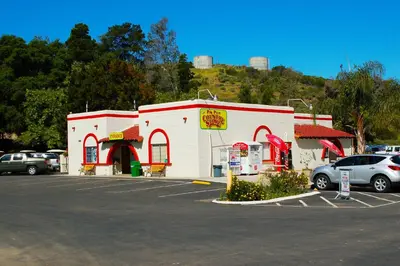 a gas station with cars parked in a parking lot at Pio Pico Camping Resort Cottage 1 in Jamul