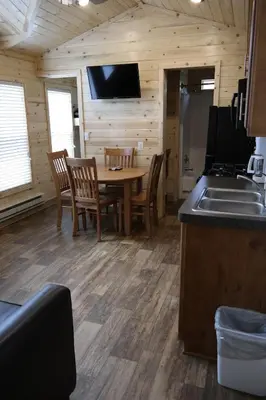 a kitchen and dining room with a table and chairs at Pio Pico Camping Resort Cottage 4 in Jamul