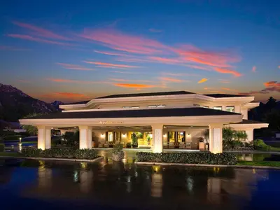 a large white building with a sunset in the background at Hyatt Vacation Club at the Welk, San Diego in Escondido