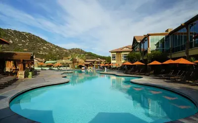 a swimming pool at a resort with chairs and umbrellas at Hyatt Vacation Club at the Welk, San Diego in Escondido