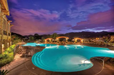 a large swimming pool at night with lights at Hyatt Vacation Club at the Welk, San Diego in Escondido