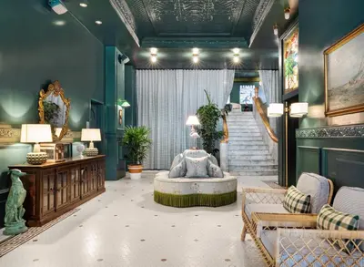 a living room with a couch and a table at Palihotel San Diego Gaslamp Quarter in San Diego