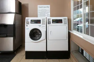 a washing machine and a dryer in a room at Signature Temecula in Temecula