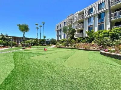 a large grassy yard in front of a building at Beachside Retreat in Oceanside