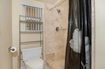 a bathroom with a toilet and a shower at Holiday Home in Oceanside