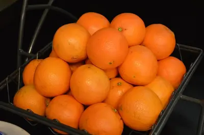 a bunch of oranges in a metal basket at Baymont by Wyndham San Diego Downtown in San Diego