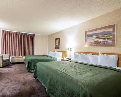 a hotel room with two beds and a window at Quality Suites San Diego Otay Mesa in Otay Mesa
