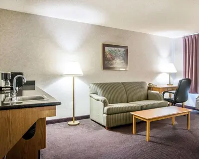 a living room with a couch and a table at Quality Suites San Diego Otay Mesa in Otay Mesa