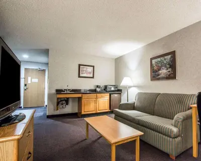 a living room with a couch and a table at Quality Suites San Diego Otay Mesa in Otay Mesa