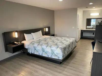 a hotel room with a bed and a desk at Motel 6-San Diego, CA - Southbay in Chula Vista