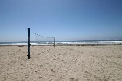a volleyball net in the sand on a beach at North Coast Village Retreat B111 in Oceanside