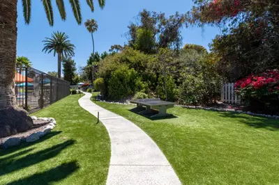 a park with a bench in the grass at San Clemente Inn in San Clemente