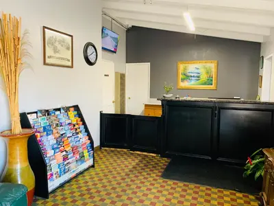 a room with a counter and a clock on the wall at Fallbrook Country Inn in Fallbrook
