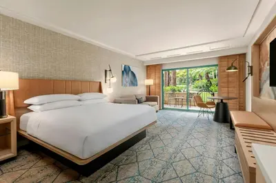a hotel room with a bed and a balcony at Sheraton La Jolla in San Diego